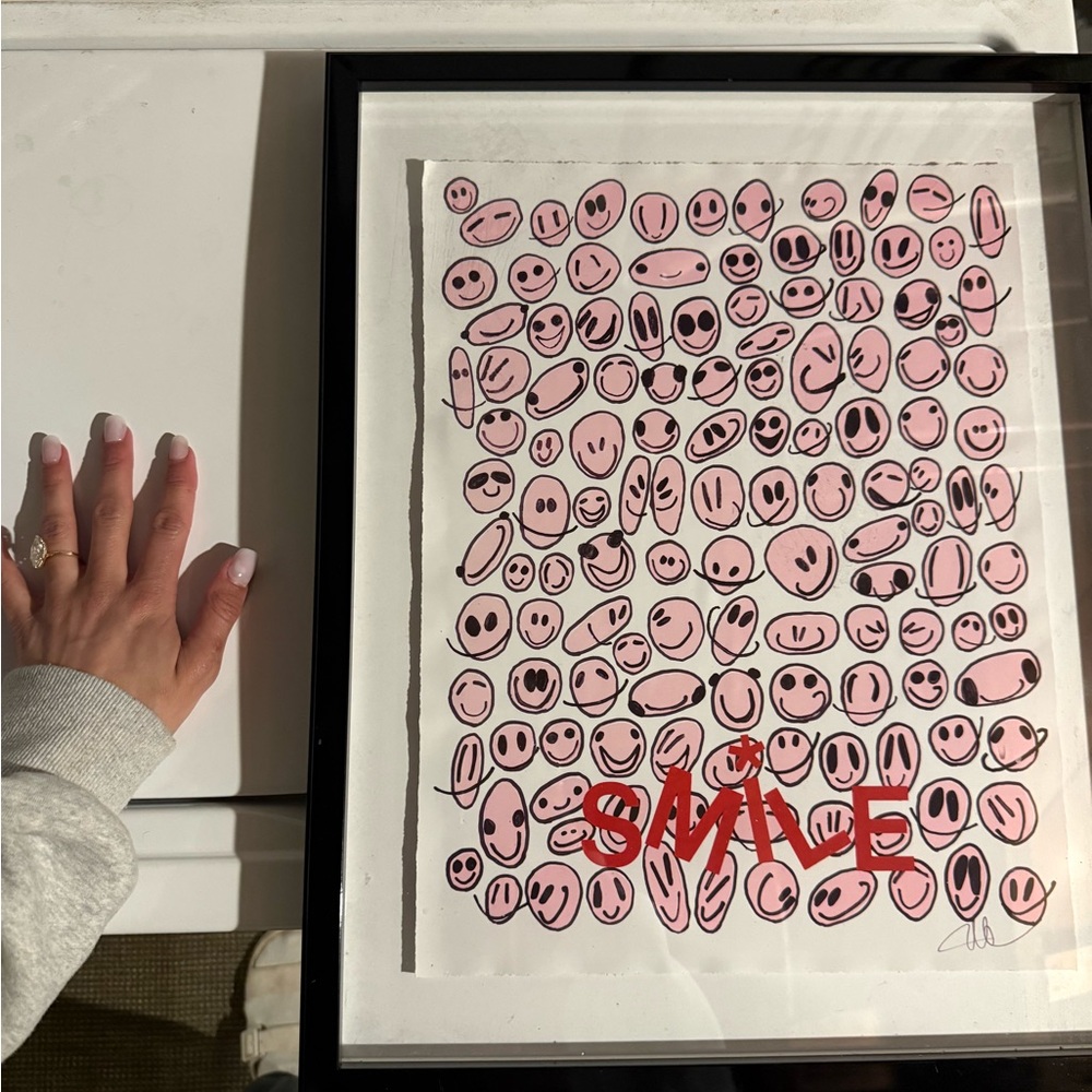 Pink smiley face framed print